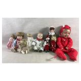 9 Porcelain and Composite Dolls w/ Various Outfits