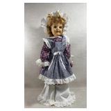 Large vtg doll wearing a patriotic dress
