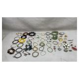 collection of various costume jewelry pieces,