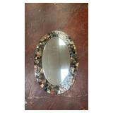 decorative wall mirror features a unique mosaic