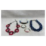 collection of acrylic statement jewelry includes