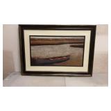 Framed print of a canoe on a lake