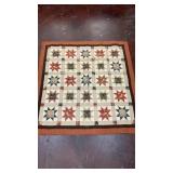 handmade star quilt featuring fabrics with