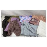 collection of various scarves, shawls, and wraps