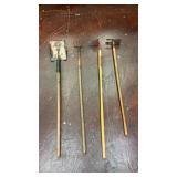 collection of four distinct garden tools with
