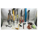collection of gardening tools, including l