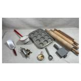 collection of vintage baking utensils and pan