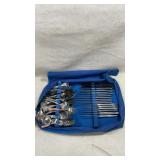 Large tray with assorted stainless steel flatware