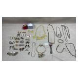 collection of costume jewelry, including various