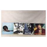 Four Vinyl Albums by Renowned Artists