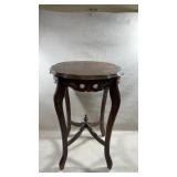 vintage French-inspired side table with a walnut