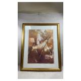framed abstract print in earthy tones resembling