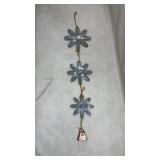 hanging wall decor features three wooden flowers