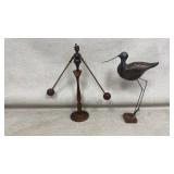 Vintage wooden balancing man and shorebird statue