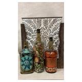 Large metal basket and painted bottles