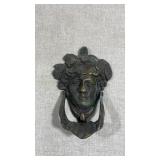 vintage solid brass door knocker featuring a