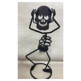 Metal skeleton candle holder