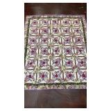 handmade patchwork quilt featuring a variation o