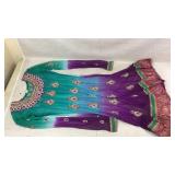 Formal Indian anarkali dress featuring a teal to