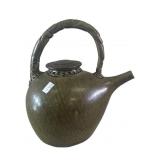 A signed green glazed ceramic tea pot