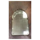 ornate vintage arched wall mirror featuring an