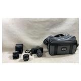 vintage Canon T70 35mm film SLR camera equipped