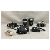 lot of vintage cameras and camera accessories,