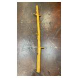 natural wooden branch or sapling with a smooth,