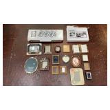 collection of mixed-material picture frames in