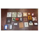 collection of mixed-material picture frames in