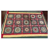 handmade quilt features a festive Dresden Plate