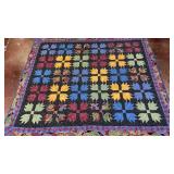handmade patchwork quilt featuring a classic b