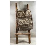 decorative woven textile or small rug draped