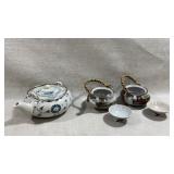 white porcelain teapot featuring a hand-painted