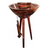 wooden standing salad bowl set on a tripod stand