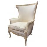 ornate, cream-colored French-style wingback