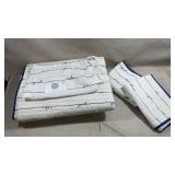 white and blue coastal-themed quilt set