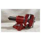 Roughneck 5" red multi-purpose bench vise with a