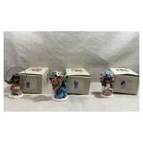 three collectible porcelain figurines from the