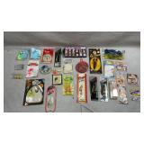 assortment of packaged fishing tackle, lures,
