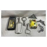 collection of workshop tools and hardware laid