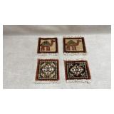 et of four hand-knotted miniature rug