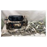 camouflage hunting gear duffel bag alongside a