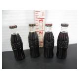 4 VINTAGE MINI COCA COLA BOTTLES WITH CAPS