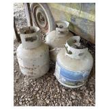 3 propane bottles with some gas