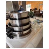 2 mixing bowls, 3 pans, juicer