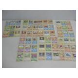 Sixty-Three Vtg Pokemon Cards In Plastic Sheets