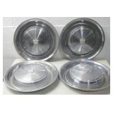 Four Cadillac Hubcaps