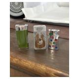 THREE VINTAGE BUTANE LIGHTERS