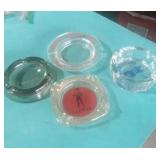 FOUR ADVERTISING ASHTRAYS
